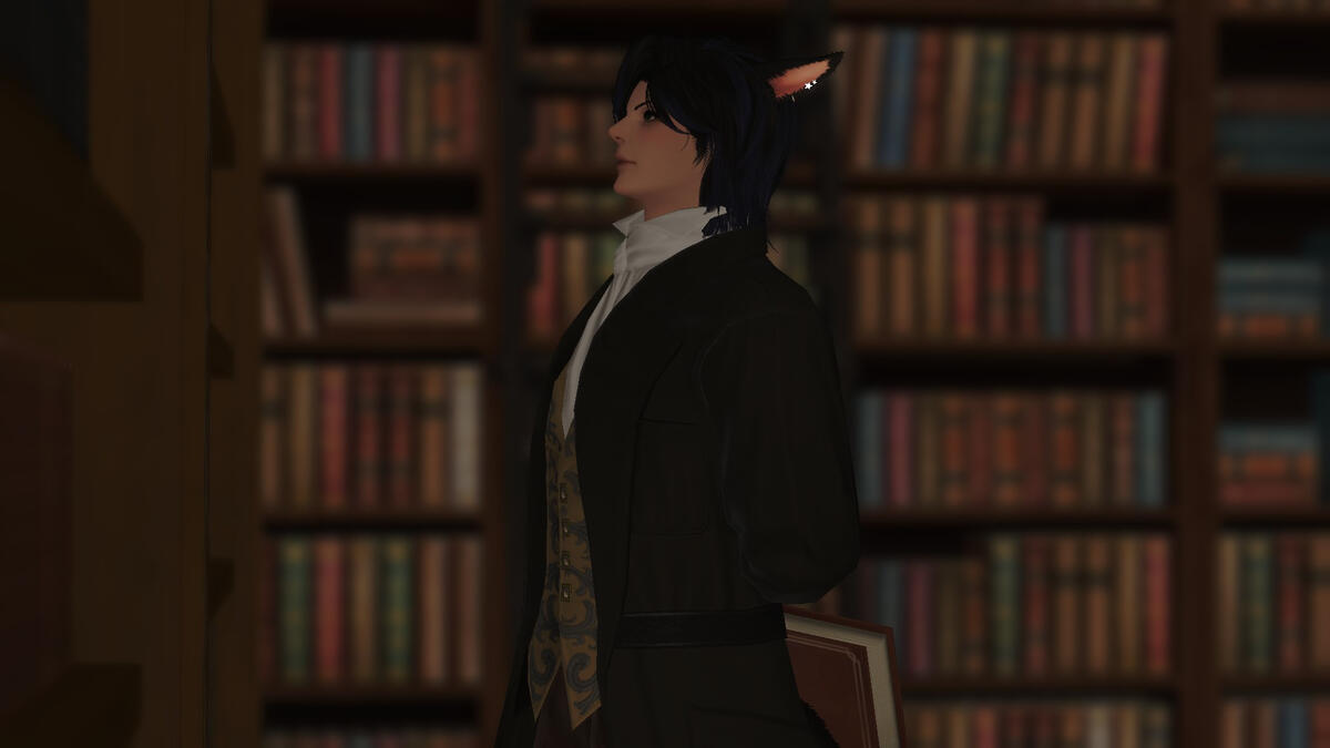 Photo by Nehzu Mercella. In a library. Overdressed. Already carrying a book. It would be hard to be more "him".